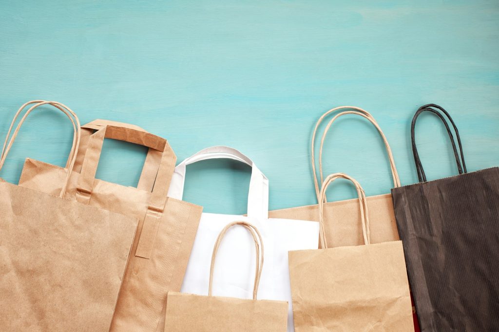 Flat lay of paper wastes ready for recycling. Using of paper bags instead of plastic